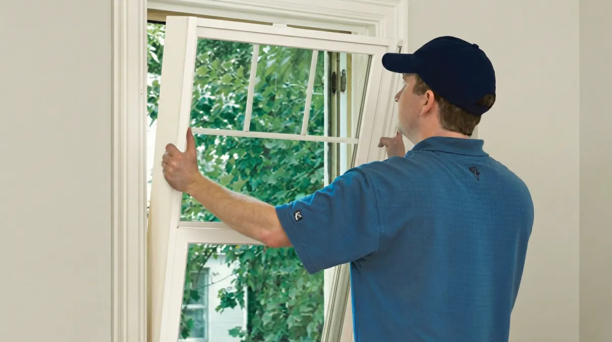 Professional contractors performing a residential window insulation and replacement service in Denver, CO
